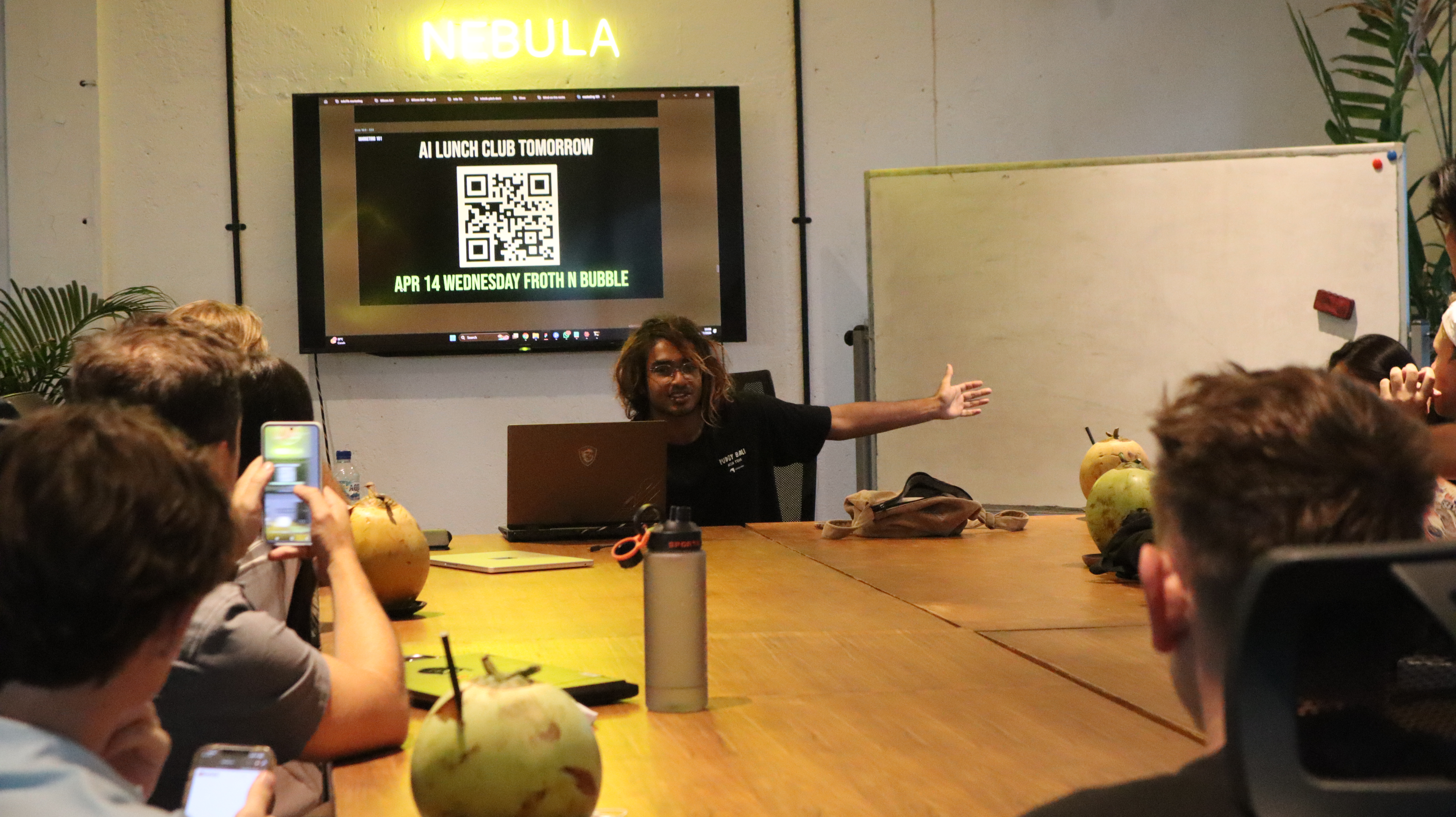 Manu presenting at event